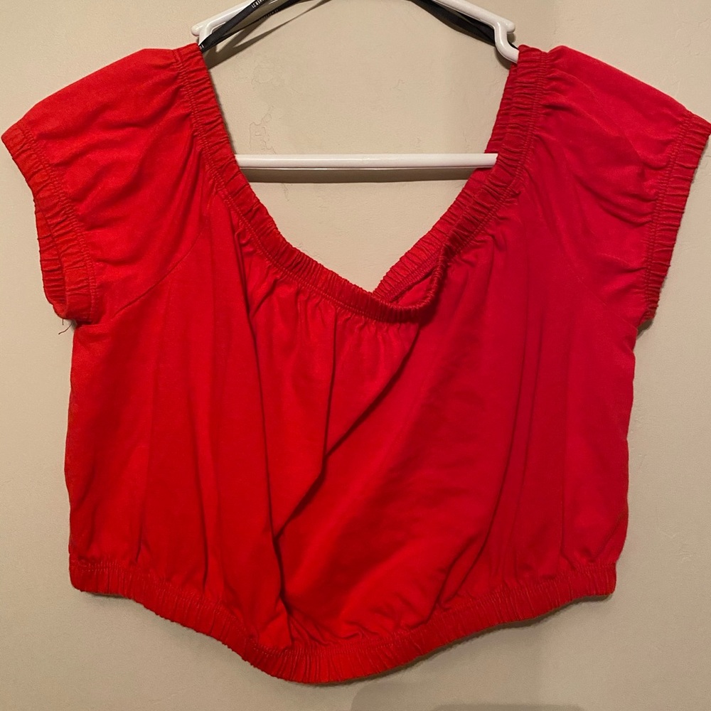 Cropped red top off shoulder